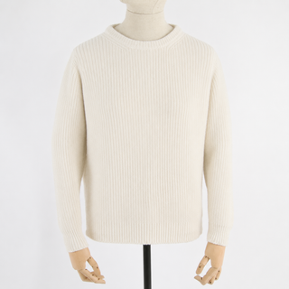 Beige sweater on a mannequin against a white background