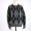 Gray argyle sweater on a mannequin against a white background