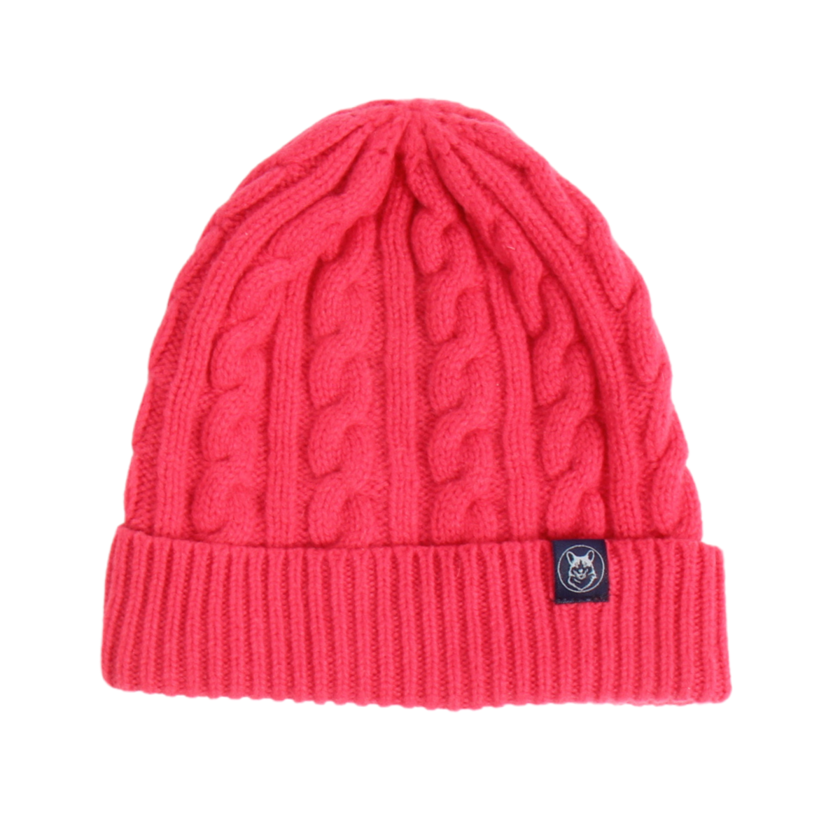 Coral cable-knit beanie hat with a ribbed cuff and a small navy brand patch on the side, shown against a plain white background.