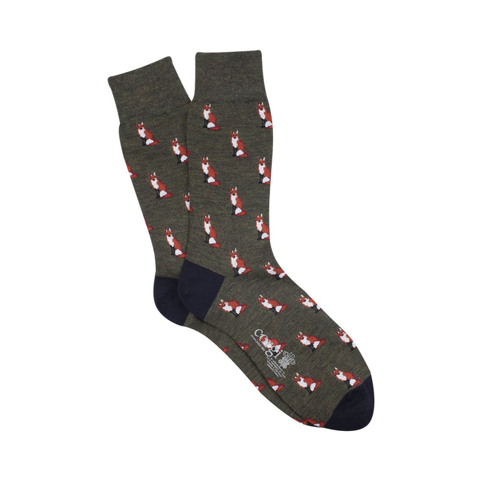 Green merino wool socks with sitting fox motif pattern