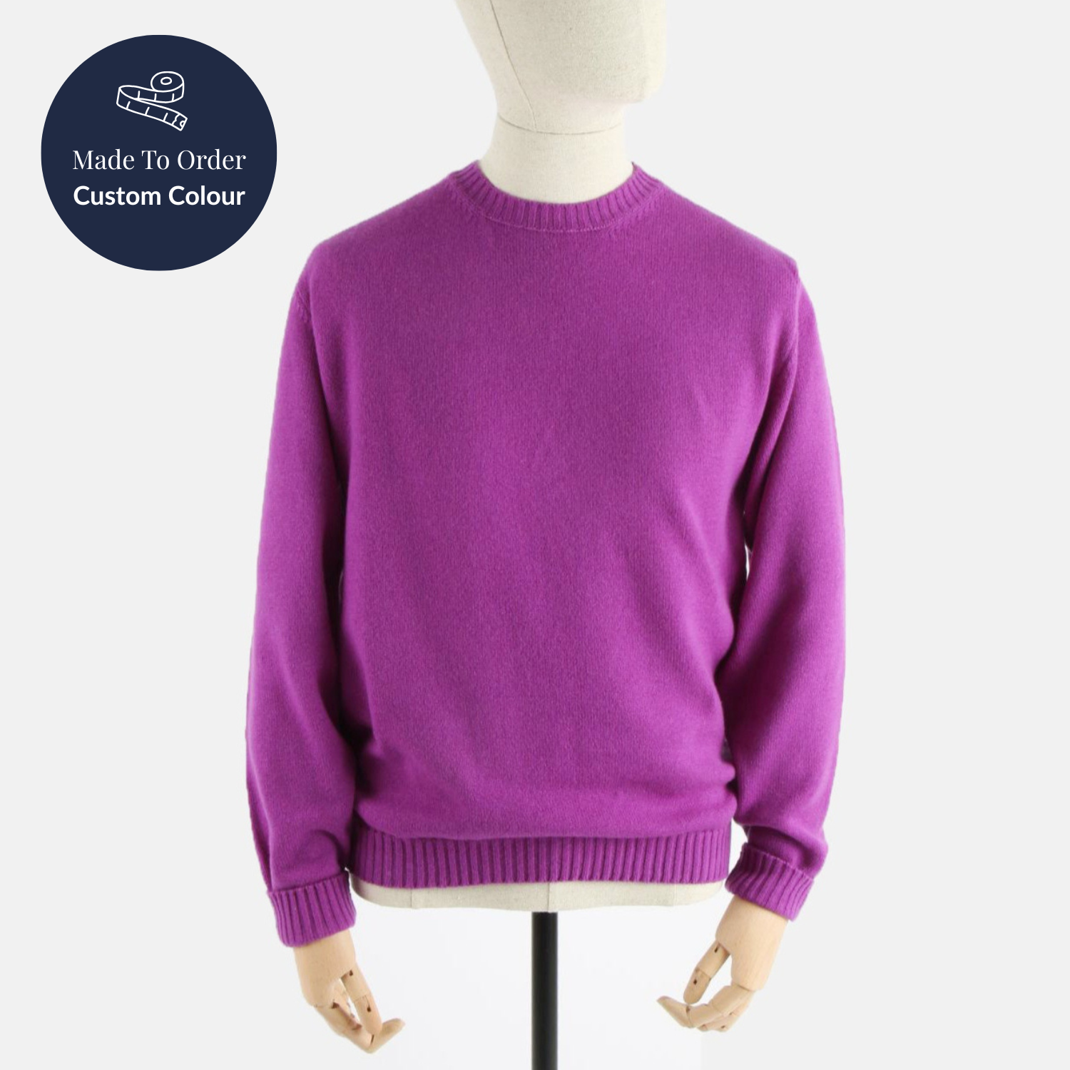 Purple sweater on a mannequin with 'Made to Order Custom Colour' label.
