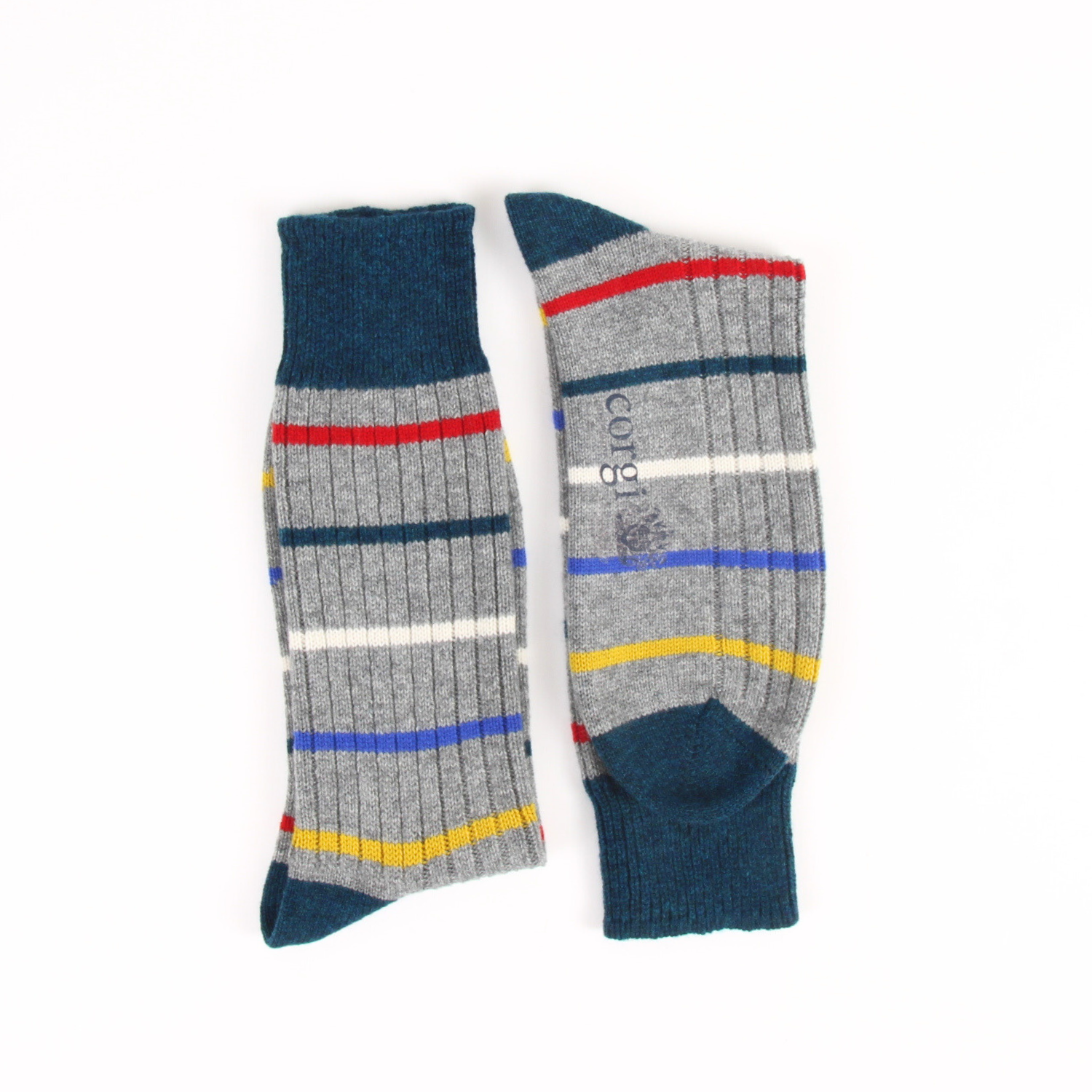 Pair of striped socks with blue, gray, red, yellow, and white colors on a white background.