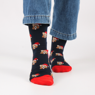 Navy blue socks with a corgi dog pattern worn with jeans