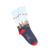 A pair of men's socks with a detailed illustration of Windsor Castle, featuring a predominantly white cuff with a red ribbon design, a blue shaft, and red heel.