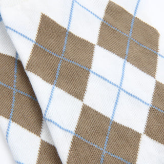 Close-up of a fabric with brown and white argyle pattern