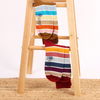 Men's Pantone Stripe Cotton Socks hanging on a wooden stool.