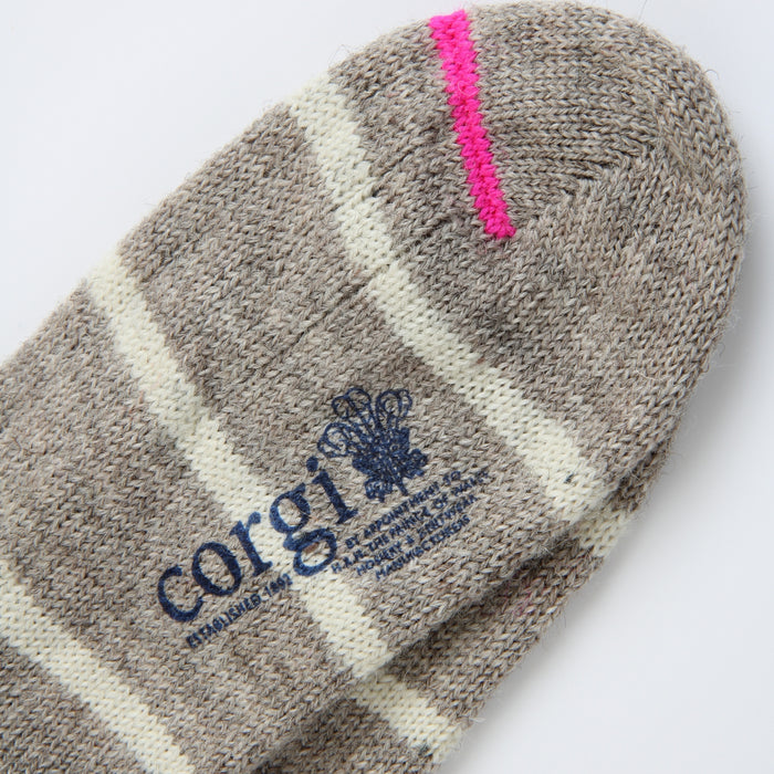 close up detail of the neon pink flash line on the toe. 