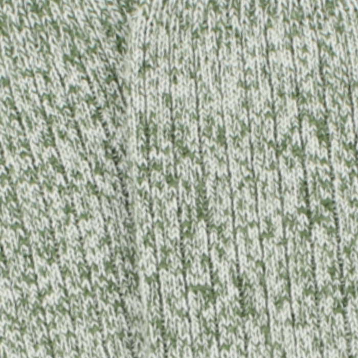 Close-up of a textured green and white fabric pattern