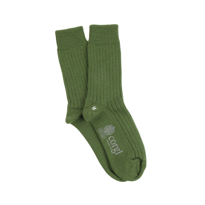 Green sock with 'corgi' branding on a white background
