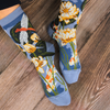Socks with floral design on a wooden floor