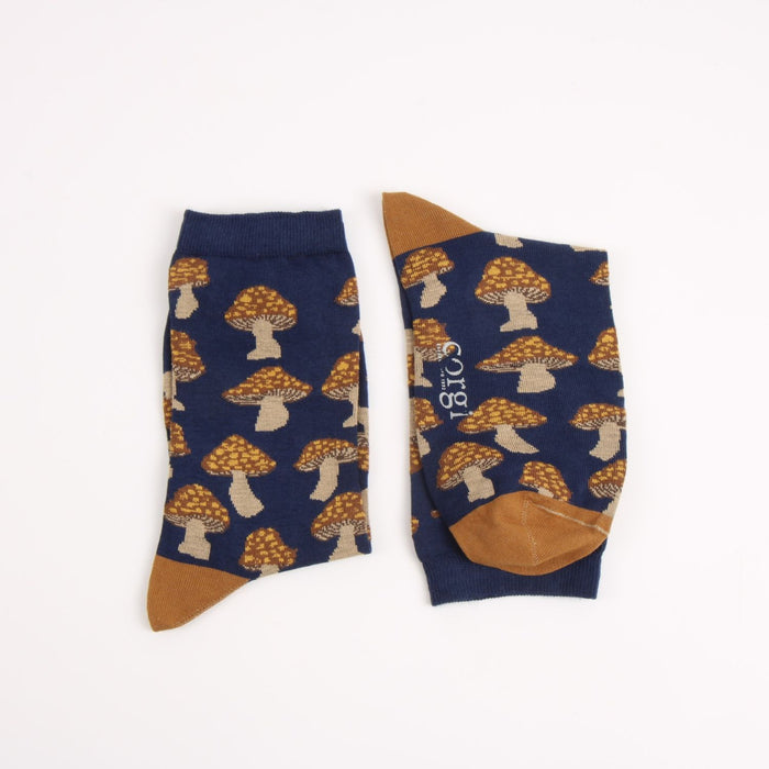 Pair of socks with mushroom pattern on a white background