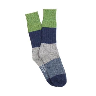 Multicolored sock with green, blue, and gray sections on a white background