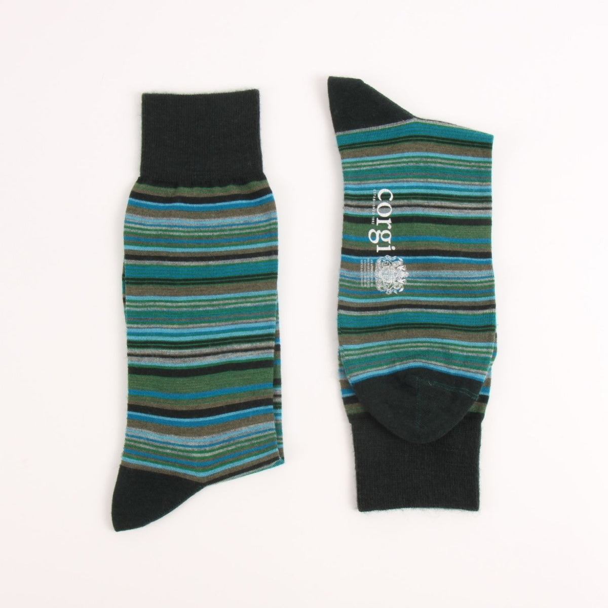 A pair of striped crew socks laid flat on a white background, showing both the front and side views. The socks feature horizontal stripes in shades of teal, green, blue, and gray, with solid black cuffs, heels, and toes.