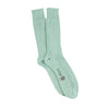Pair of light green socks on a white background