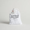 White drawstring bag with 'Clothes Doctor London' branding on a light gray background