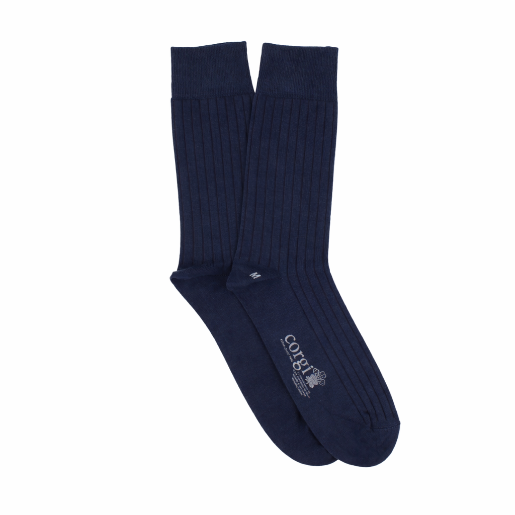 Pair of navy blue socks with a brand logo on a white background