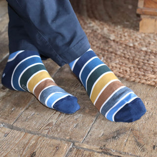 striped socks in tones of blue  with a fine white stripe between each colour