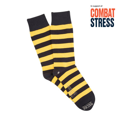 Black and yellow striped socks on a white background with 'Combat Stress' text.