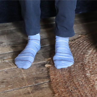 man wearing thin stripe cotton socks in light blue