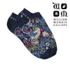 Navy blue socks with intricate floral pattern on a white background, featuring the William Morris Gallery logo.