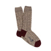 A pair of hand-knitted brown cable cashmere and cotton socks with the brand 'Corgi' visible.